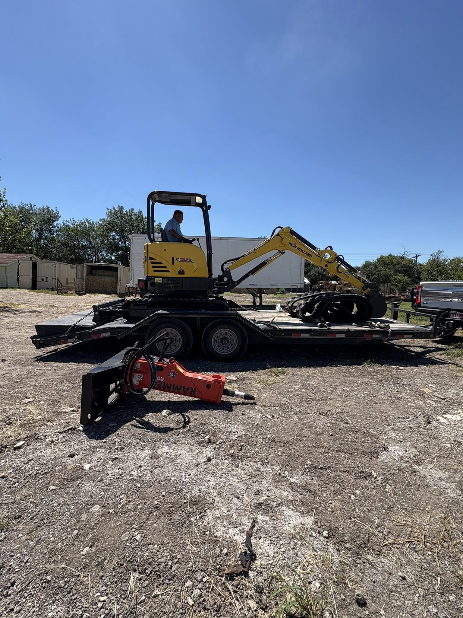 Yellow excavator with standalone hydraulic breaker